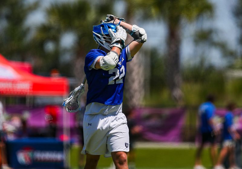 Community School of Naples Seahawks midfielder Sean McNamara (22) reacts after the St. Andrew's Scots score a goal during the first quarter of the Class 1A state semifinal at Paradise Coast Sports Complex in Naples, Fla., on Thursday, May 7, 2026.