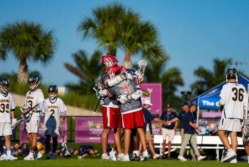 Manatee Hurricanes attack Easton Miller (1), midfielder Harrison Westendorf (14) and attack Devon McGonigle (10) hug after the team was defeated in the Class 2A state semifinal by the St. Thomas Aquinas Raiders at Paradise Coast Sports Complex in Naples, Fla., on Thursday, May 7, 2026.