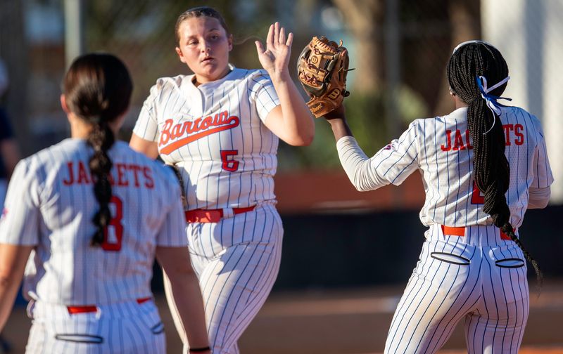 Bartow pitcher Ryleigh Knowlton gives a high-five to second baseman Niamah Johnson after recording the third out in the top of the first inning.