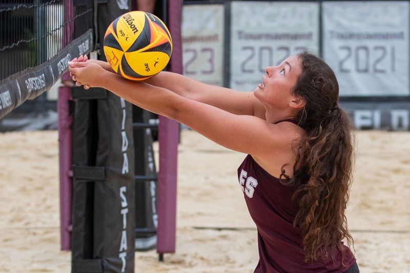 Natalie Gibson (8) passes to her partner. The Chiles Timberwolves advance to the beach volleyball state championships after defeating the Lourdes Academy Bobcats on Friday, May 8, 2026.