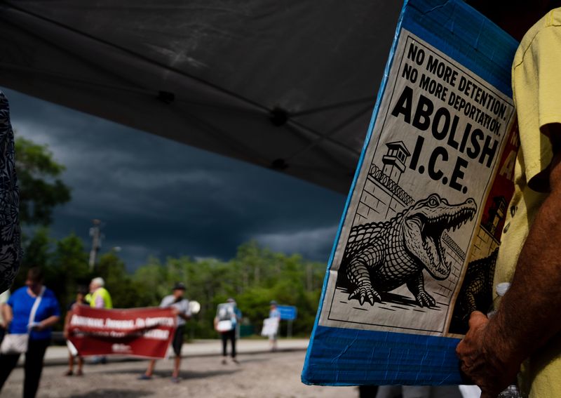 Protestors gather for a weekly vigil across the street from Alligator Alcatraz in Ochopee in Collier County on Sunday, April 19, 2026. Since the opening of the controversial detention center, people have been gathering on Sundays to protest.