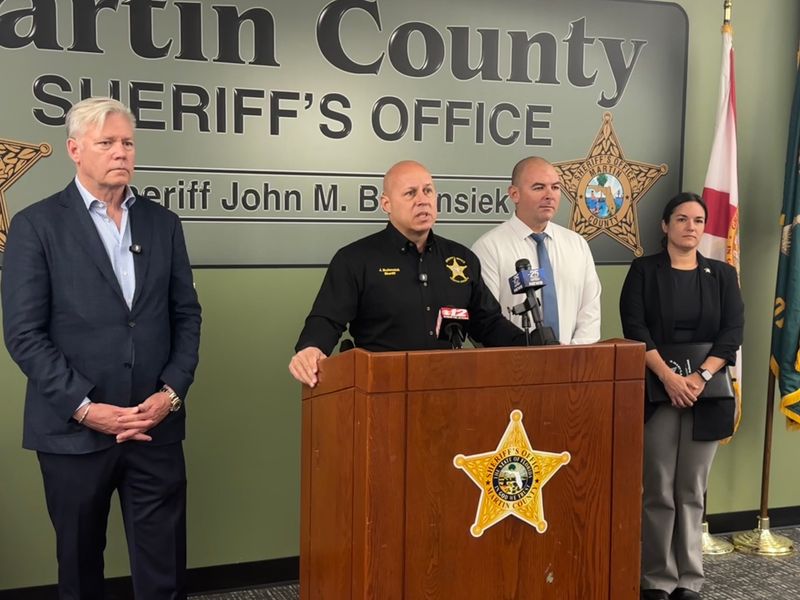 From left, Chris Hansen, Martin County Sheriff John Budensiek, Capt. Gavin Werner and Sgt. Erin Spencer, during a media briefing on May 8, 2026, regarding an online underage sex sting.