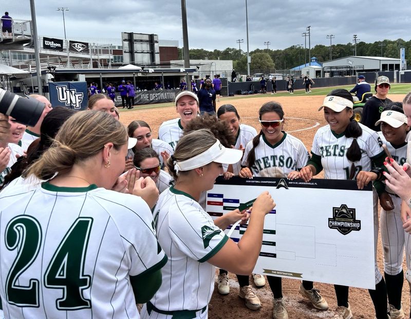 Stetson softball players watch as pitcher Caitlyn Kulczyski put the team's name on the ASUN Softball Tournament bracket in the championship game slot after beating Central Arkansas 8-2 on May 8 at the University of North Florida Softball Complex in Jacksonville.