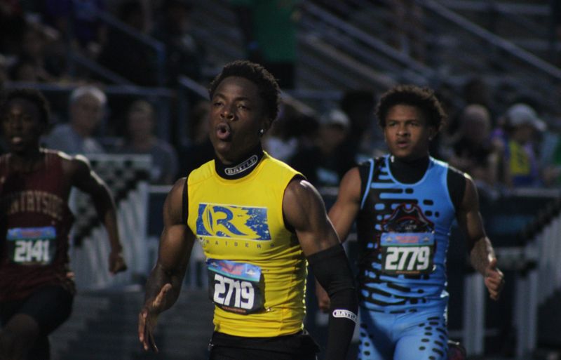 Tallahassee Rickards' Davion Crumitie (2719) pulls ahead in the boys 200 during the FHSAA Class 3A high school track and field championships in Jacksonville, Florida, on May 8, 2026. [Clayton Freeman/Florida Times-Union]