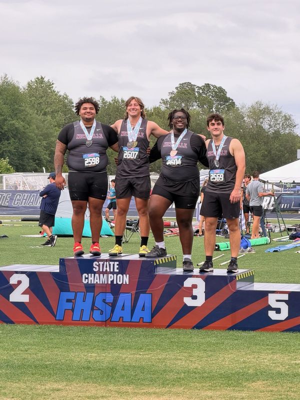 Niceville's four state medalists in the shot put, including state champ Charlie Perkins, pose on the podium after earning a collective 28 points to help lead the Eagles to a team state title. NICEVILLE HIGH