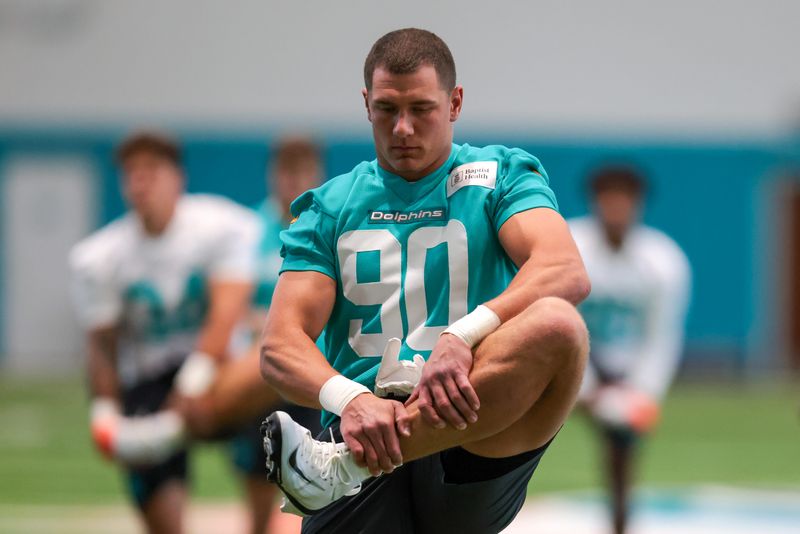 May 8, 2026; Miami Gardens, FL, USA; Miami Dolphins edge Mason Reiger (90) works during rookie minicamp at Baptist Health Training Complex. Mandatory Credit: Sam Navarro-Imagn Images