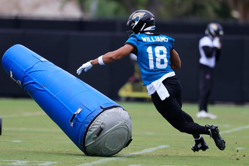 Jacksonville Jaguars wide receiver CJ Williams (18) knicks over a blocking pad during rookie minicamp at the Miller Electric Center, Saturday, May 9, 2026 in Jacksonville, Fla. Today was the second of a three day camp concluding Sunday.