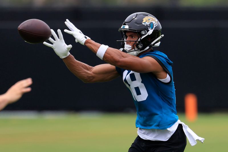 Jacksonville Jaguars wide receiver CJ Williams (18) catches a pass during rookie minicamp at the Miller Electric Center, Saturday, May 9, 2026 in Jacksonville, Fla. Today was the second of a three day camp concluding Sunday.