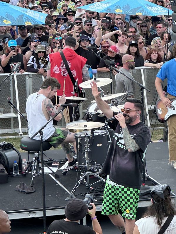 A Day To Remember frontman Jeremy McKinnon waves to an audience that wrapped around a makeshift stage at Welcome To Rockville at Daytona International Speedway in Daytona Beach on May 9, 2026.