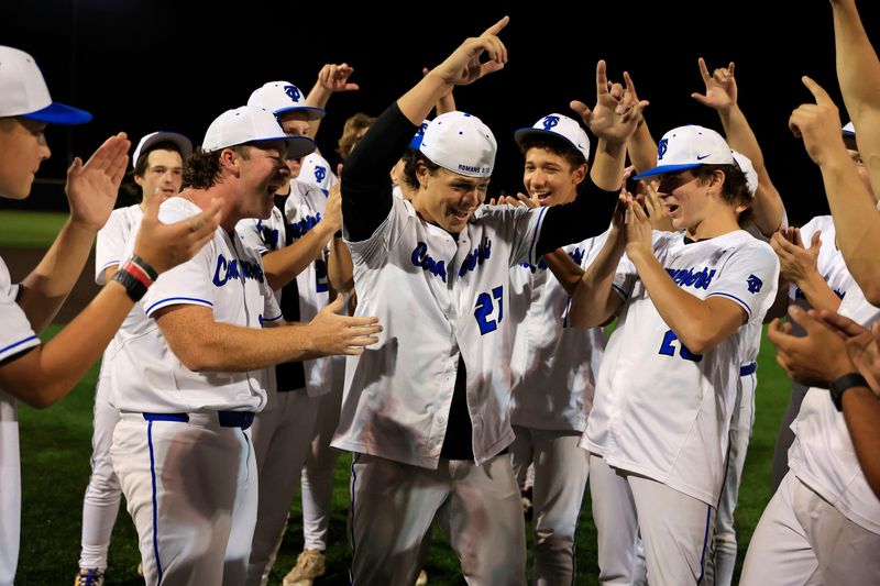 Trinity Christian's Jordan Martinez (center, 23) and teammates celebrate their regional championship against Bishop Snyder. The Conquerors finished their postseason run by defeating True North for the Class 2A state title.