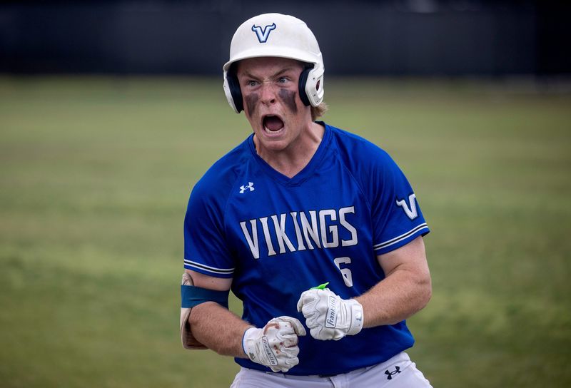 Lakeland Christian's Maclain Irby reacts after beating out a bunt against Orlando First Academy on Saturday in the Class 2A, Region 3 finals.