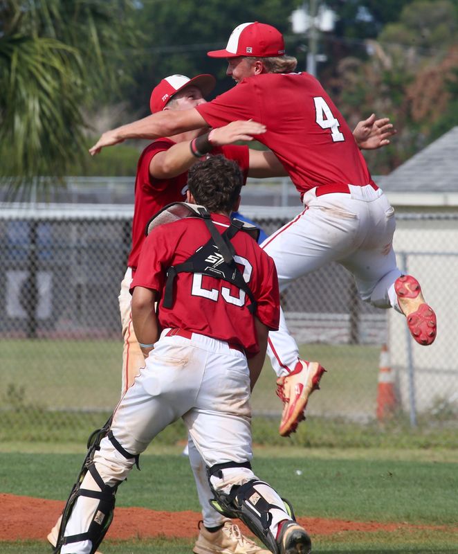 Vero Beach High pitcher Colt Miller jumps into the arms of teammate Cody Morgan as catcher Dom Lopez approaches after defeating Park Vista in Game 2 of the best-of-3 series Saturday afternoon in Vero Beach. Vero Beach swept the series to move to the Final 4.