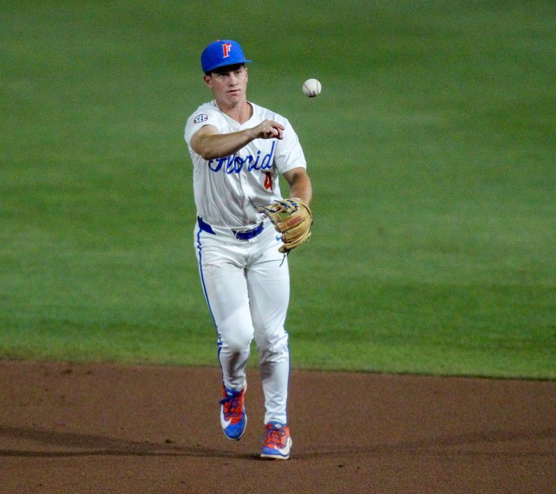 Florida baseball second baseman Cade Kurland throws out a runner during the Gators' series against Kentucky at Condron Ballpark.