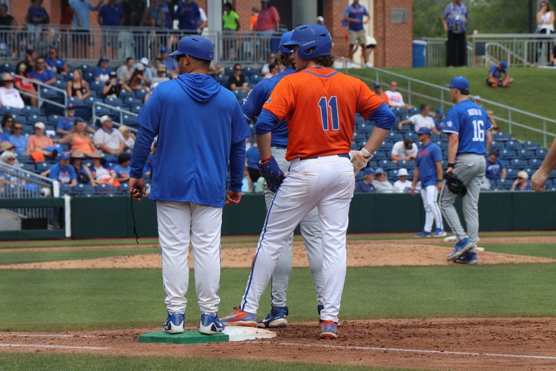 Brendan Lawson stands with Florida's first base coach. Florida Gators vs Kentucky Wildcats college baseball at Condron Family Ballpark on Sunday, May 10, 2026