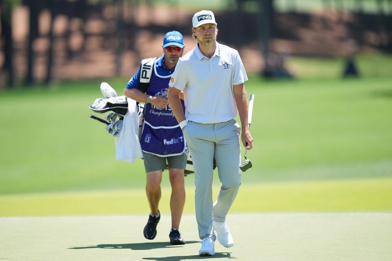 May 10, 2026; Charlotte, North Carolina, USA; Kristoffer Reitan walks up to five green during the final round of the Truist Championship golf tournament. Mandatory Credit: Jim Dedmon-Imagn Images