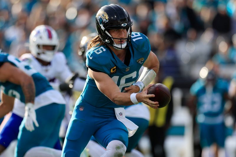 Jacksonville Jaguars quarterback Trevor Lawrence (16) looks to handoff during the fourth quarter of an NFL football AFC Wild Card playoff matchup, Sunday, Jan. 11, 2026, in Jacksonville, Fla. The Bills defeated the Jaguars 27-24. [Corey Perrine/Florida Times-Union]