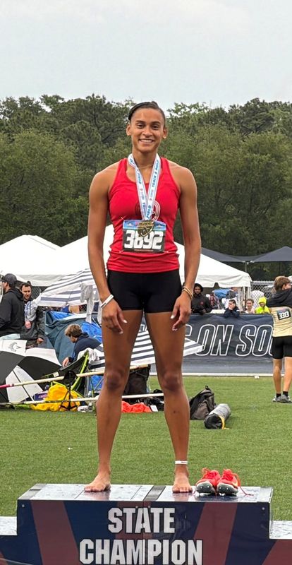Vero Beach junior Taylor-Nicole Overton stands at the top of the podium after taking first place in the 400-meter run during the Class 4A FHSAA State Championships on Saturday, May 9, 2026 from from the Visit Jax Track at Hodges Stadium in Jacksonville.