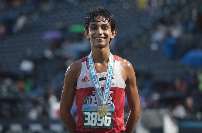 Vero Beach senior Andrew Youssef stands at the top of the podium after taking first place in the 3,200-meter run during the Class 4A FHSAA State Championships on Saturday, May 9, 2026 from from the Visit Jax Track at Hodges Stadium in Jacksonville.