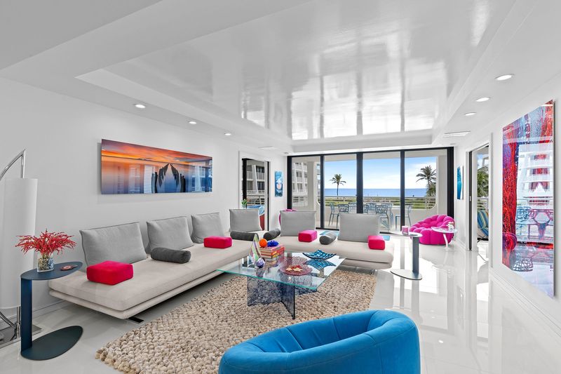 Glass doors look out to the ocean in the living area of an extensively renovated condominium at 2600 S. Ocean Blvd. in Palm Beach. The two-bedroom apartment is listed at $2.695 million.