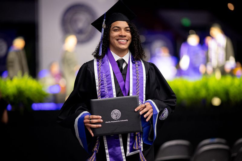 Chandler Mullin receives his bachelor’s degree in computer science at Florida Polytechnic University’s commencement ceremony on May 9 at the RP Funding Center in Lakeland.
