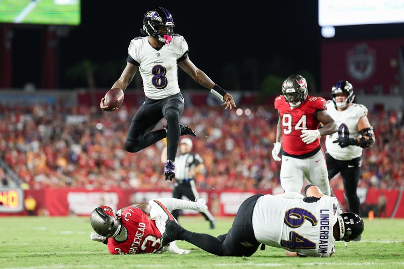 Oct 21, 2024; Tampa, Florida, USA; Baltimore Ravens quarterback Lamar Jackson (8) runs with the ball against the Tampa Bay Buccaneers in the second quarter at Raymond James Stadium. Mandatory Credit: Nathan Ray Seebeck-Imagn Images