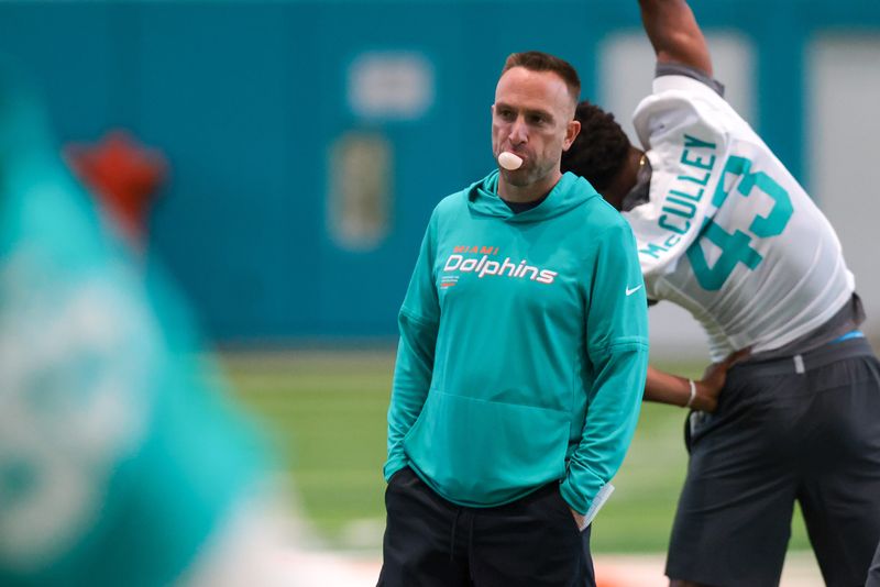 Miami Dolphins head coach Jeff Hafley works with his players during rookie minicamp at Baptist Health Training Complex.