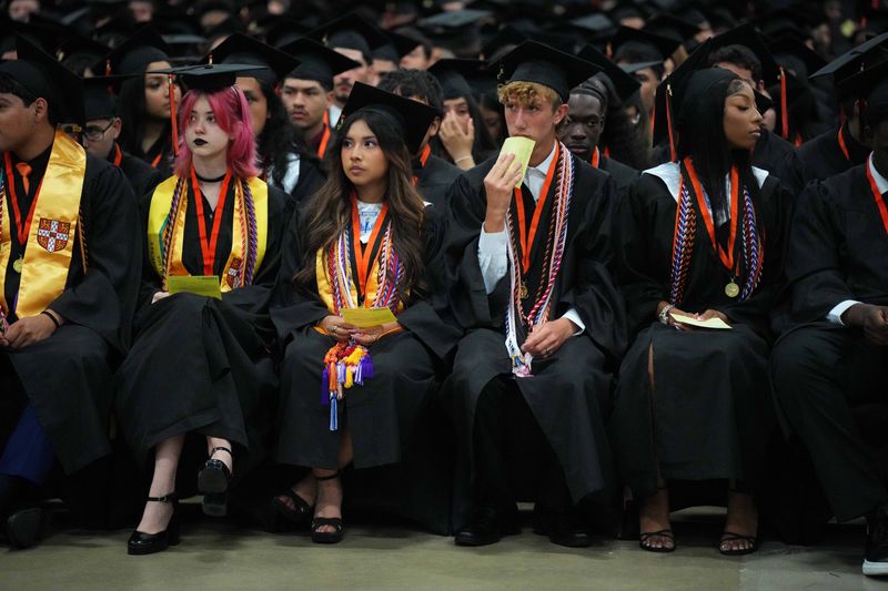 Students and faculty gather during the John I. Leonard High School graduation ceremony at the South Florida Fairgrounds on May 12, 2026, in suburban West Palm Beach, Florida.