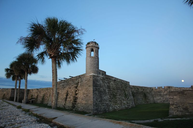 A full moon setting at the Castillo de San Marcos National Monument