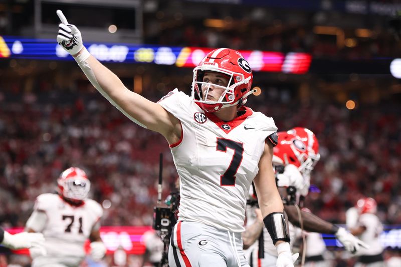 Dec 6, 2025; Atlanta, GA, USA; Georgia Bulldogs tight end Lawson Luckie (7) celebrates after a touchdown during the third quarter against the Alabama Crimson Tide during the 2025 SEC Championship game at Mercedes-Benz Stadium. Mandatory Credit: Brett Davis-Imagn Images