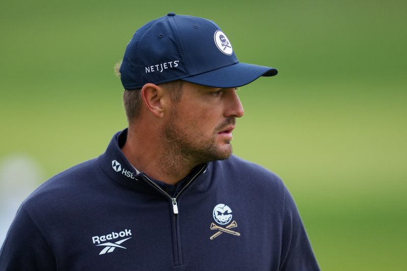May 14, 2026; Newtown Square, Pennsylvania, USA; Bryson DeChambeau watches on the 11th green during the first round of the PGA Championship golf tournament at Aronimink Golf Club. Mandatory Credit: James Lang-Imagn Images