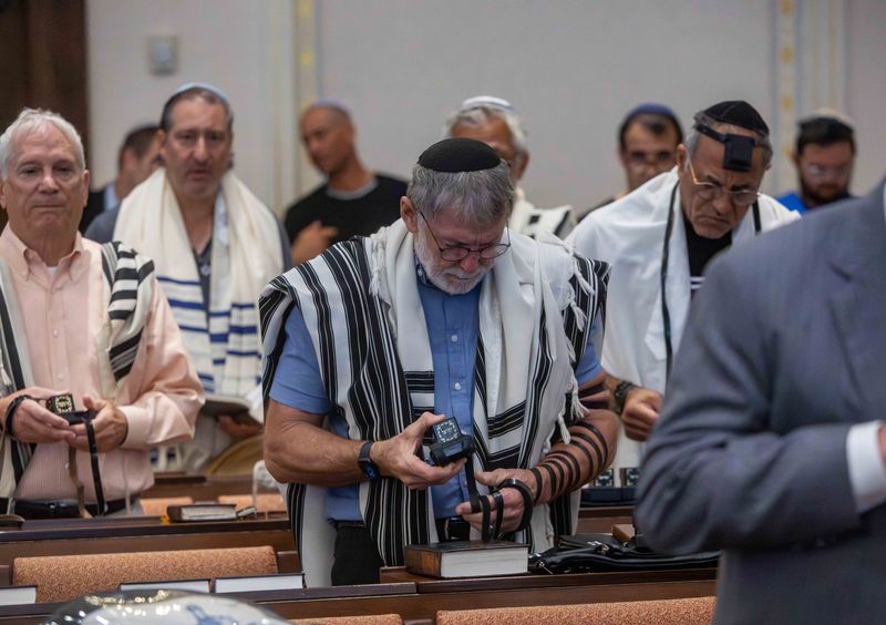 Members of the Palm Beach Synagogue pray on Oct. 7, 2024, before the start of a commemoration service for the deadly 2023 attacks in Israel by Hamas and other groups.