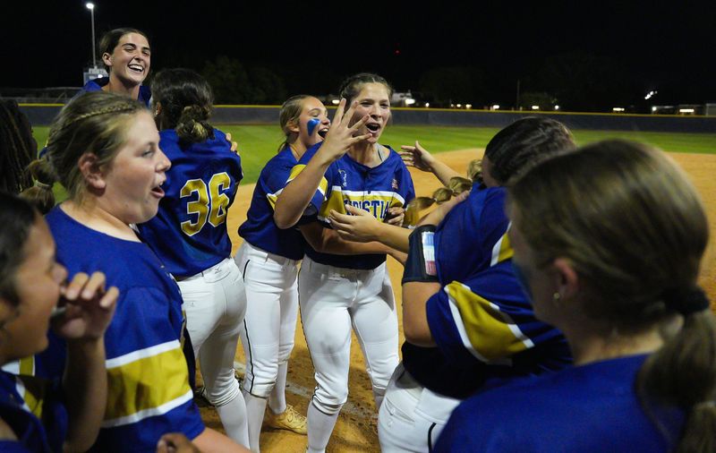 University Christian Dixie Tessier (77) celebrates with teammates after University Christian defeated Tallahassee St. John Paul II 1-0.