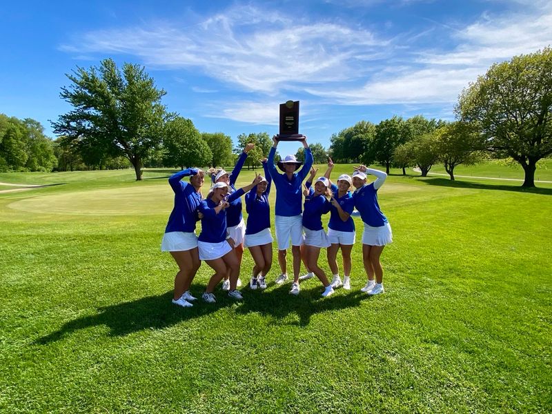 The Daytona State women's golf team hoists its 2026 national championship trophy on May 14. The Falcons have won 12 titles in program history.