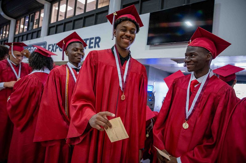 Lake Worth Community High School students prepare for graduation ceremonies at the South Florida Fairgrounds and Expo Center in unincorporated Palm Beach County, Fla., on May 14, 2025.