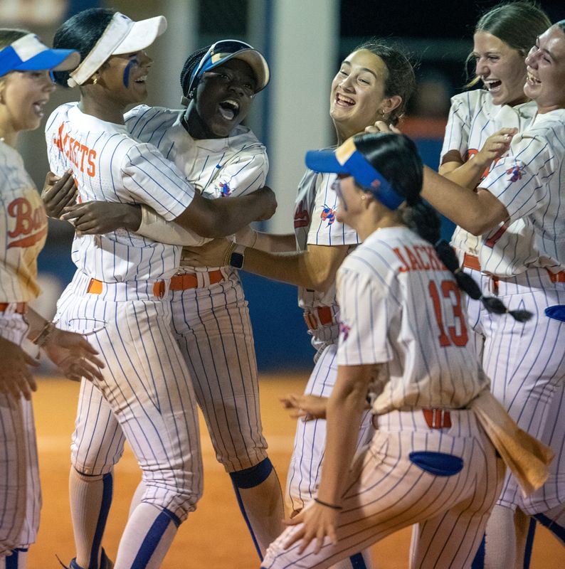 Bartow softball players celebrate after defeating Melbourne on Thursday night in the Class 6A, Region 2 finals.