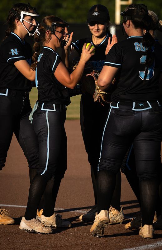 North Bay Haven's Addison Mallon huddles with the infield during their Class 2A Region 1 Final game against Baldwin at Lanford Field in Panama City, Florida, May 14, 2026. North Bay Haven would go on to win the game 8-3. (Tyler Orsburn/Panama City News Herald)