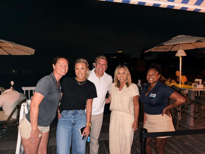 Todd and Julie Chrisley and their daughter Savannah Chrisley stopped by Benny’s on the Beach, posing for a photo along the pier deck with the Atlantic just behind them.