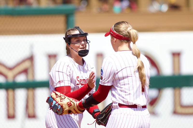 FSU softball’s Jazzy Francik high fives Hayley Griggs after an out as the Seminoles host Stetson in the NCAA Tallahassee regional on Friday, May, 15, 2026.