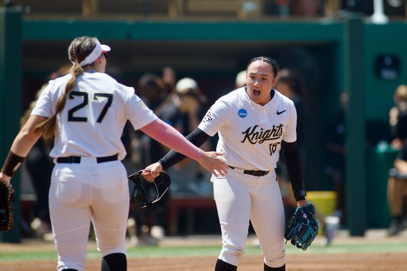 UCF pitcher Tori Payne celebrates an out with first base Ashleigh Griffin in the NCAA Tallahassee regional against Jacksonville State on Friday, May 15, 2026 in Tallahassee, Florida