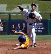 Buchholz second baseman Blake Brewer forces Martin County's Frankie Brancaleone at second base and completes the double play in the Class 6A State Semifinal on Friday at Lee Health Sports Complex - Hammond Stadium in Fort Myers. Buchholz defeated the Tigers, 3-2.