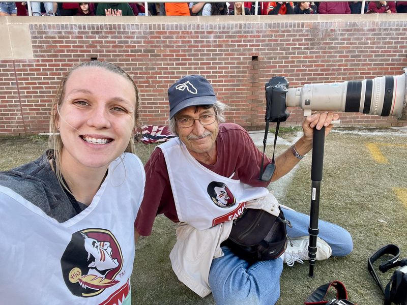Tallahassee Democrat photojournalist Alicia Devine with former Democrat photojournalist Mark Wallheiser at a Florida State football game in 2021.