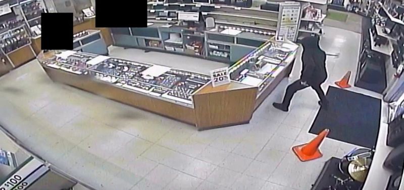 Orange City police say one of two masked robbers doused people with bear spray while another smashed a jewelry glass case with a hammer in an attempted robbery of a pawn shop.