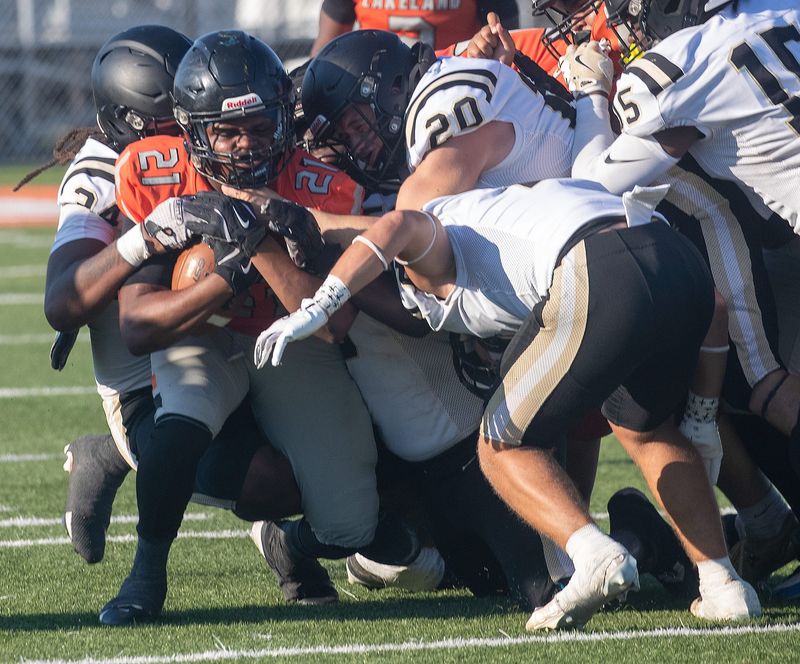 Lakeland running back Ahnarri Cooper fights for yardage against Gainesville Buchholz on Friday night at Bryant Stadium.