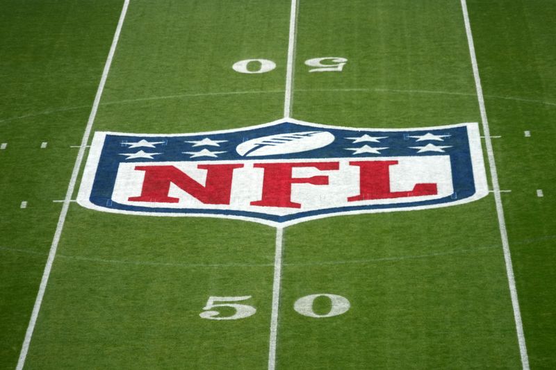 Nov 9, 2025; Berlin, Germany; The NFL shield logo at midfield at the NFL Berlin Game at Olympic Stadium. Mandatory Credit: Kirby Lee-Imagn Images