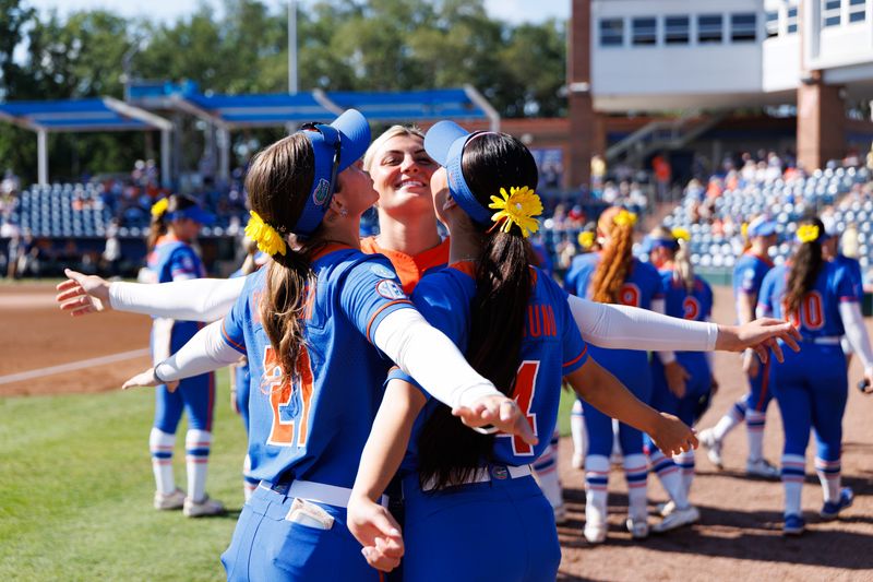 May 16, 2026; Gainesville, FL, USA; Florida Gators outfielder Taylor Shumaker (21), Florida Gators pitcher Caroline Stanton (1) and Florida Gators infielder Kalie Matsuno (4) huddle before the game against the Georgia Tech Yellow Jackets at Katie Seashole Pressly Stadium. Mandatory Credit: Matt Pendleton-Imagn Images