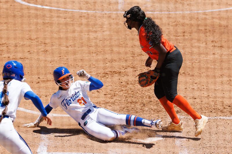 May 15, 2026; Gainesville, FL, USA; Florida Gators outfielder Taylor Shumaker (21) slides into home plate for a run while Florida A&M Rattlers catcher Keeleigh Spooner (23) watches during the third inning at Katie Seashole Pressly Stadium. Mandatory Credit: Matt Pendleton-Imagn Images