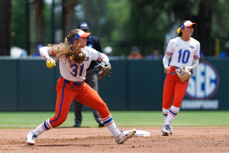May 17, 2026; Gainesville, FL, USA; Florida Gators infielder Kenleigh Cahalan (31) throws the ball to first base for an out against the Georgia Tech Yellow Jackets during the second inning at Katie Seashole Pressly Stadium. Mandatory Credit: Matt Pendleton-Imagn Images