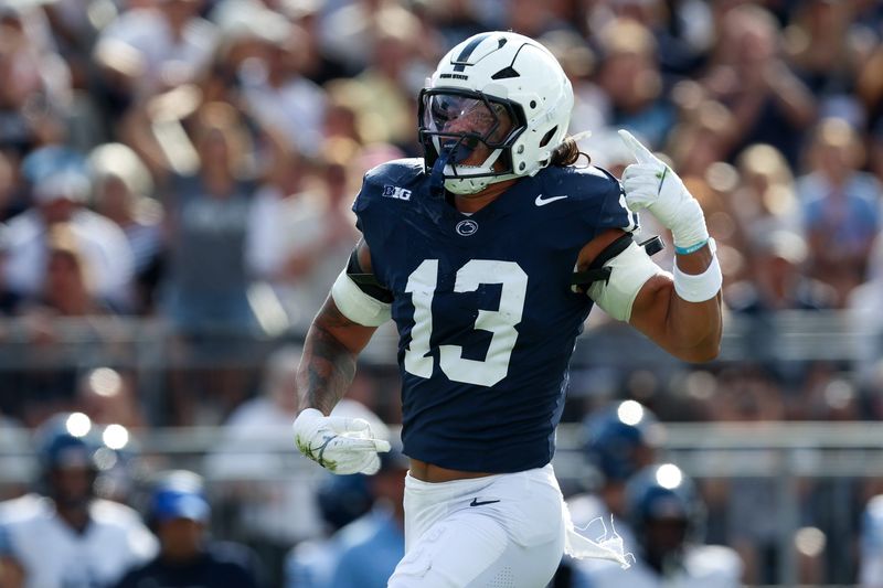 Sep 13, 2025; University Park, Pennsylvania, USA; Penn State Nittany Lions linebacker Tony Rojas (13) reacts following a sack on Villanova Wildcats quarterback Tanner Maddocks (3) during the second quarter at Beaver Stadium. Mandatory Credit: Matthew O'Haren-Imagn Images