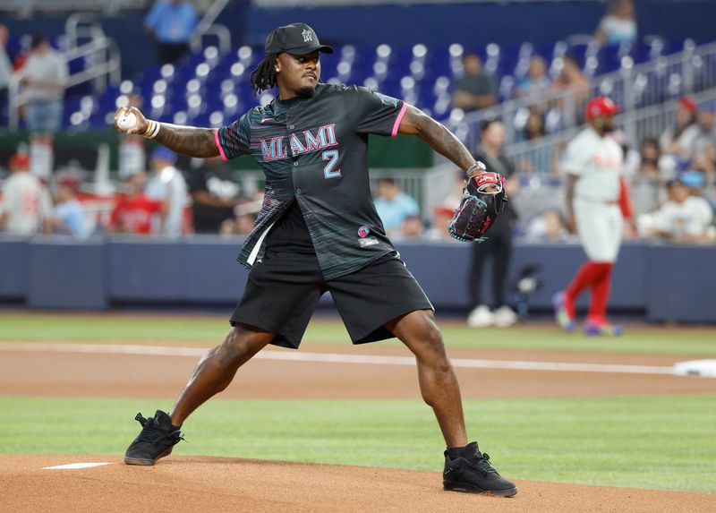 May 1, 2026; Miami, Florida, USA; Miami Dolphins new quarterback Malik Willis throws a ceremonial first pitch before the game between the Philadelphia Phillies against the Miami Marlins at loanDepot Park. Mandatory Credit: Rhona Wise-Imagn Images