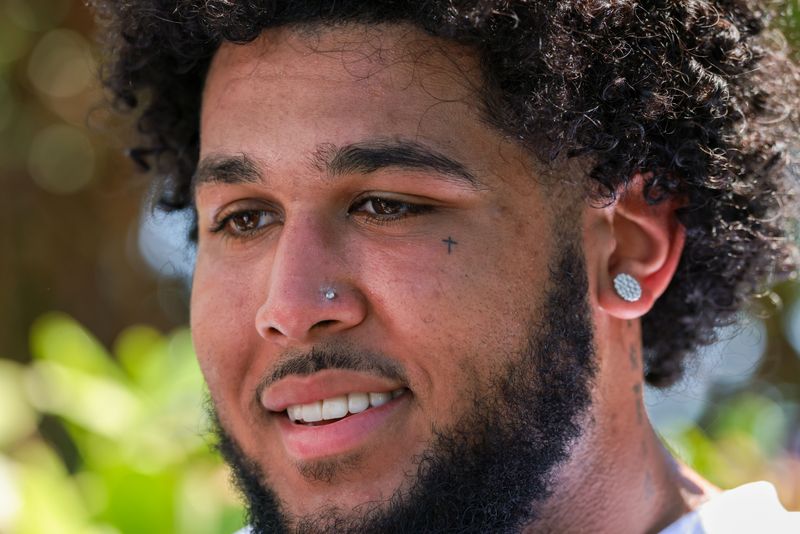 Miami Dolphins guard Kadyn Proctor speaks to reporters during rookie minicamp at Baptist Health Training Complex.